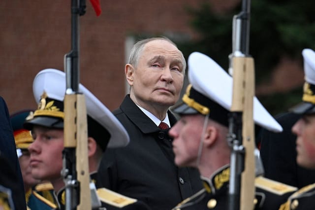 Putin Holds Muted Victory Day Parade as Trump Brokers Ukraine Ceasefire