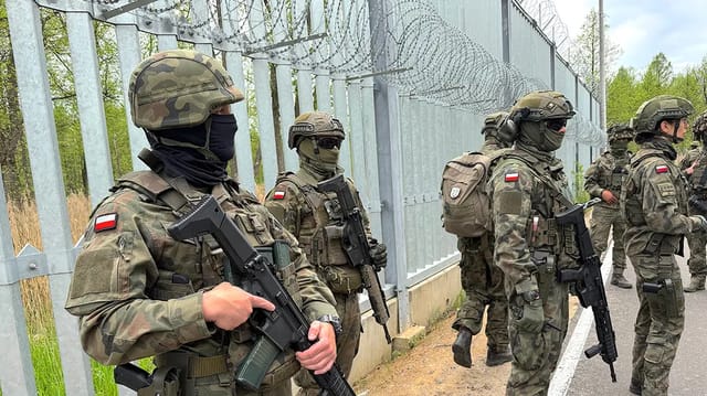 Poland Deploys Iron Division Against Russian Migrant Warfare on NATO Border