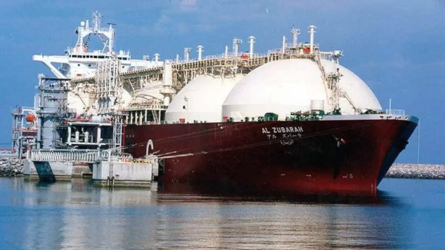 A Qatari liquefied natural gas (LNG) tanker being loaded with LNG at the seaport of Ras Laffan, in northern Qatar.