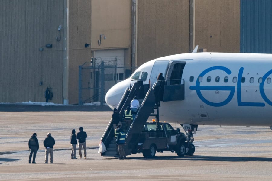Deportees boarding a chartered plane at Minneapolis-St. Paul airport in February.